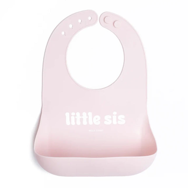 Pink baby bib with 'little sis' text 