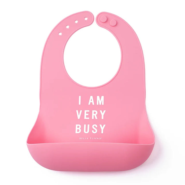 Pink bib with 'I am very busy" text