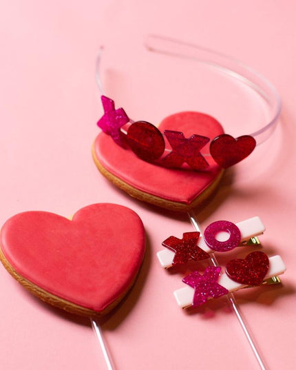 Heart shaped cookies with xoxo red and pink glitter headband and hair clips