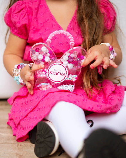 Girl holding Pink Butterfly Shaped Bead Kit 