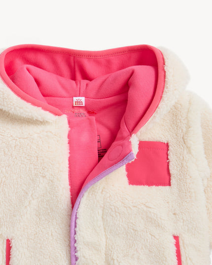 Cream sherpa hoodie with pink  and purple accents 